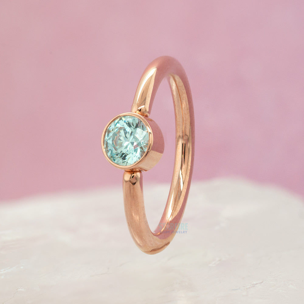 Captive Bead Ring (CBR) in Gold with Bezel-set Cyan CZ Captive Bead