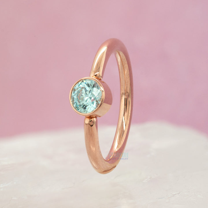 Captive Bead Ring (CBR) in Gold with Bezel-set Cyan CZ Captive Bead