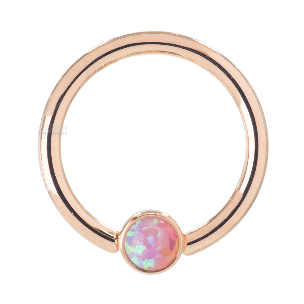 Captive Bead Ring (CBR) in Gold with Bezel-set Pink Opal Captive Bead