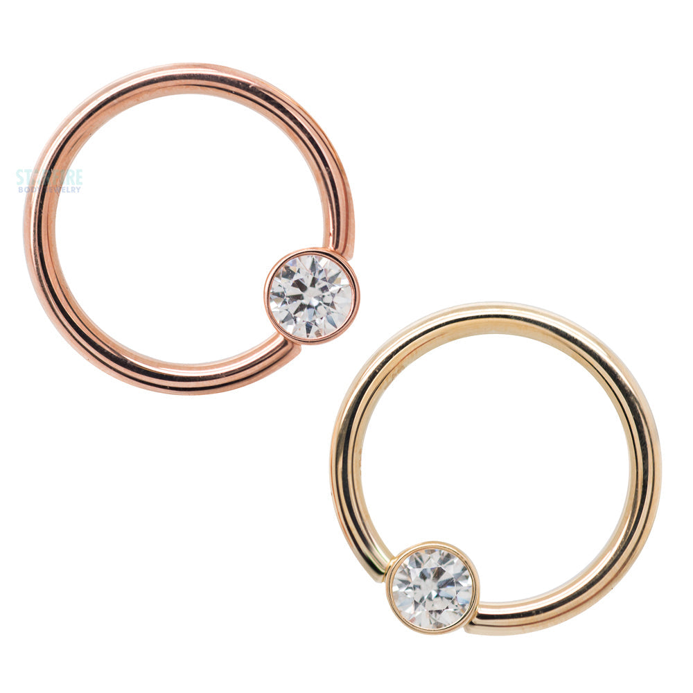 Captive Bead Ring (CBR) in Gold with Bezel-set Salmon CZ Captive Bead