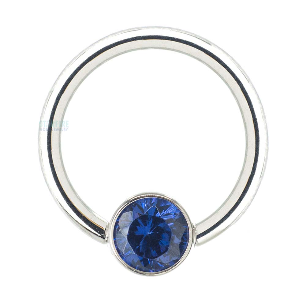 Captive Bead Ring (CBR) in Gold with Bezel-set Synthetic Tanzanite Captive Bead