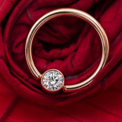 Captive Bead Ring (CBR) in Gold with Bezel-set Salmon CZ Captive Bead