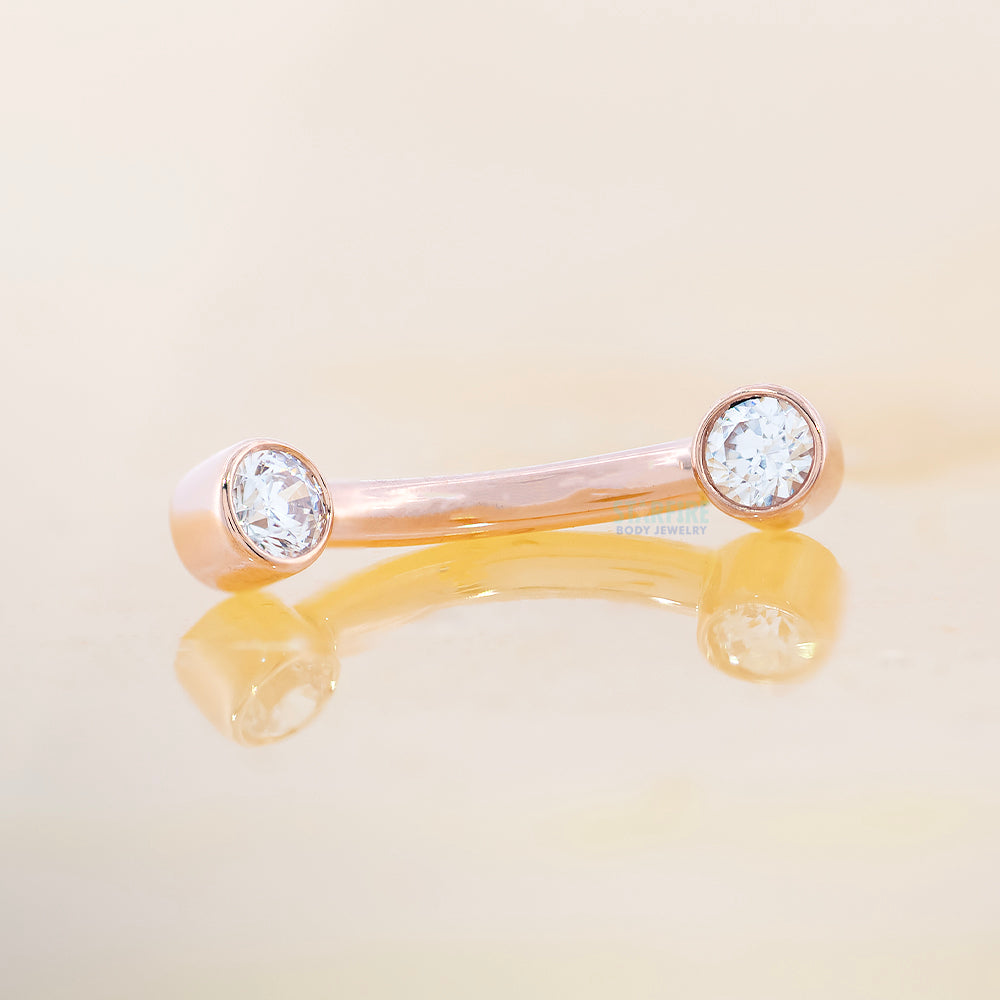 Gold Curved Barbell with White CZ's in Forward Facing Bezels
