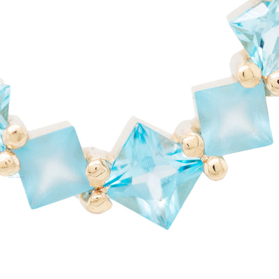 Graduating Tiffany Hinge Ring in Gold with Swiss Blue Topaz with Alternating Sandblasted Gems