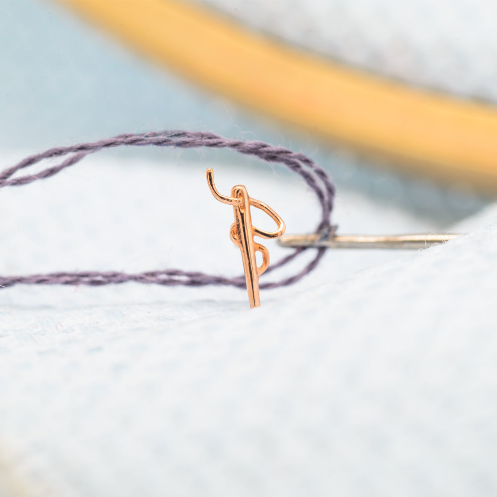 threadless: Needle and Thread End in Gold